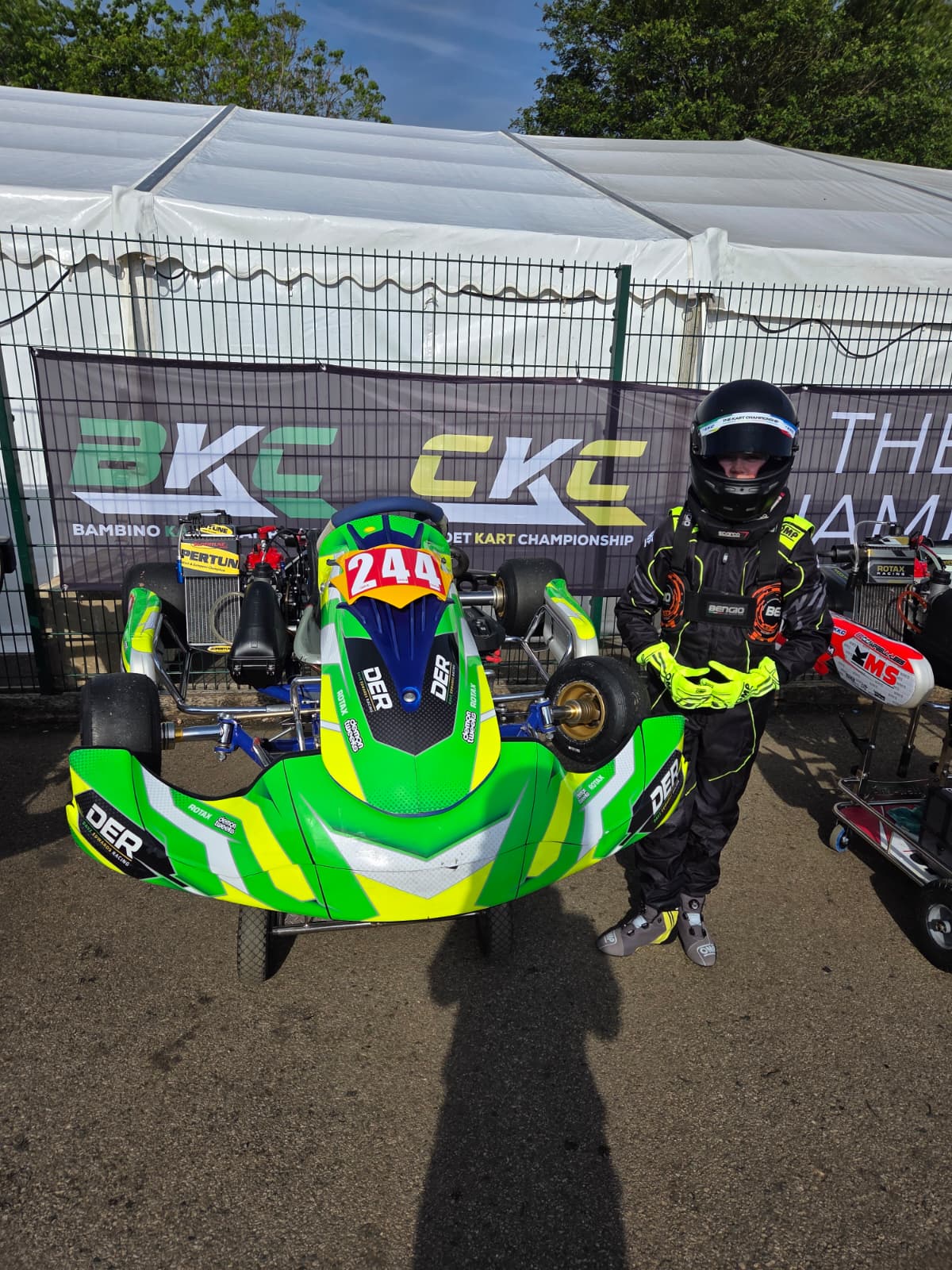 Driver with DER kart in the paddock